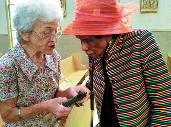 CLARKSDALE – Immaculate Conception parishioner, Sister Manette Durard (left) talks with Lucretia Jones during the parish’s 69th anniversary celebration Mass  Sunday, Sept. 7. Afterwards, Earl Gooden gave a brief history of the parish. (Photo by Christine McDaniel)