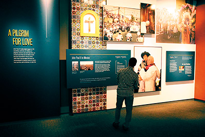 A man looks at an exhibit at the St. John Paul II National Shrine in Washington Oct. 7. The facility hosts exhibits and events relating to St. John Paul and to the history of the Catholic Church in North America. (CNS photo/Bob Roller)