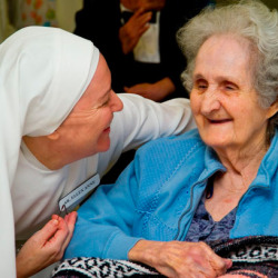 Sister Ellen Anne visits with a resident at the facility. The Little Sisters are hosting a discernment retreat Nov. 14-16 in Mobile. (Photos and story courtesy of Sister Carolyn Martin, LSP)