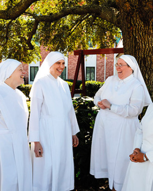 Little Sisters of the Poor spend time together on the lawn of the Sacred Heart Residence