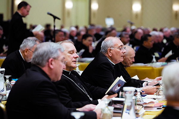 In this 2013 file photo, members of the U.S. Conference of Catholic Bishops pray before an afternoon session during the bishops’ annual fall meeting in Baltimore. Liturgical matters will take center stage during this year’s meeting, to be held Nov. 10-13 in Baltimore. (CNS photo/Nancy Phelan Wiechec)