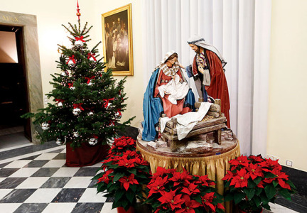 A Nativity scene and Christmas tree decorate the Apostolic Palace at the Vatican Dec. 15. (CNS photo/Paul Haring)