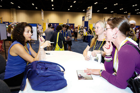 Chicago-based bullying expert Jodee Blanco meets April 8 with participants at the National Catholic Educational Association’s annual convention, held this year in Orlando, Fla. Bullying was a popular workshop topic at the April 7-9 convention. (CNS photo /Tom Tracy)