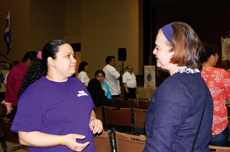 GREENWOOD – Maribel Sánchez (left) talks with Danna Johnson during the Hispanic Encuentro at the Civil Center Saturday, April 18.  (Photo by Elsa Baughman)