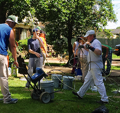 Volunteers from Wayne, Ill., and representatives from Sherwin Williams painted 14 homes in Greenwood in June. (Photo courtesy of Kim Walker)