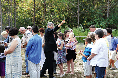 While there, he consecrated a cemetery expansion, celebrated Mass. (Photos courtesy of John Keith)