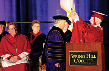 Chairman of the Board Michael Coghlan presents Dr. Puto with the SHC presidential medallion. Archbishop Rodi is in the background. (Photos courtesy of Spring Hill College)