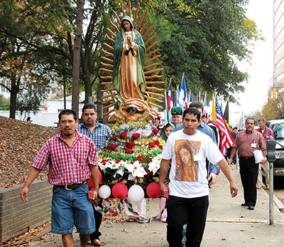 Members of the Cathedral of St. Peter the Apostle process with the statue of the Virgin of Guadalupe around the Smith Park every year praying the rosary before the 2 p.m. Mass.