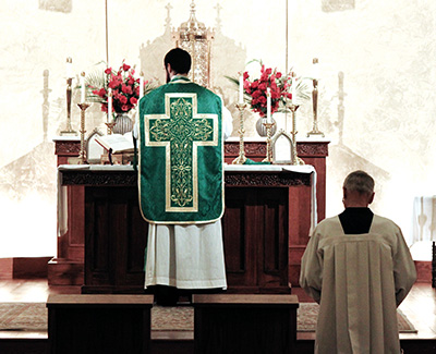 One of the most visual differences in Mass in the Extraordinary Form is that the priest celebrates with his back to the people. (Photo by Gene Buglewicz)