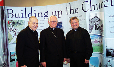 Monsignor Jerome O. Sommer, (left)  Bishop Houck, Father Luis Studer, OMI, at the Catholic Extension100th exhibit. Reprinted with permission from Catholic Extension. Copyright 2016.www.catholicextension.org