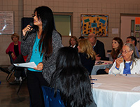 MADISON – Evelin López, from Carthage St. Anne Parish, shares thoughts with the bishop at St. Francis of Assisi Parish. (Photo by Elsa Baughman)