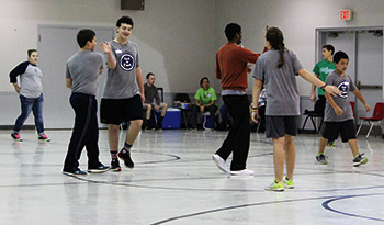 MERIDIAN – The youth group from Philadelphia celebrates during a game at a deanery youth day at St. Patrick Parish. (Photo courtesy of Lydia Berry)