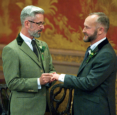 A same-sex couple exchange rings during their marriage ceremony in 2014 in Brighton, England. In his postsynodal apostolic exhortation on the family, "Amoris Laetitia" ("The Joy of Love"), released April 8, Pope Francis repeated his and the synod's insistence that the church cannot consider same-sex unions to be a marriage, but also insisted, "every person, regardless of sexual orientation, ought to be respected in his or her dignity." (CNS photo/Will Oliver, EPA)