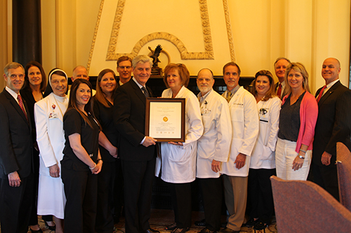 Governor Phil Bryant recently recognized St. Dominic's achievement of being the state's only Joint Commission-certified Advanced Comprehensive Stroke Center.  Pictured from left to right: Claude W. Harbarger, President of St. Dominic Health Services, Jennifer Sinclair, Executive Vice President of St. Dominic Hospital, Larry Riddles, Vice President of Medical Affairs, Amber Nesenson, RN, Emergency Room, Cameron Murphy, RN, Director of Nursing, Trace Swartzfager, Vice President of Business Development, Governor Phil Bryant, Dr. Ruth Fredericks, Neurologist, Co-director of St. Dominic’s Comprehensive Stroke Center, Dr. David McHenry, Neurologist, Dr. Scott McPherson, Interventional Radiologist, Co-director of St. Dominic’s Comprehensive Stroke Center, Dr. Tiffany Scarff, Neurologist, Cris Bourn, Neuroscience Service Line Administrator, Wendy Barrilleaux, Director of Stroke Services, and Lester K. Diamond, President of St. Dominic Hospital.  