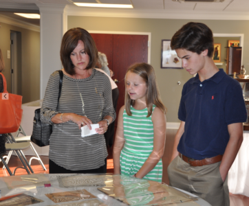 Ashely Roesch and her children, Madelyn and Brayden look at photos. (Photos by Mary Margaret Halford.