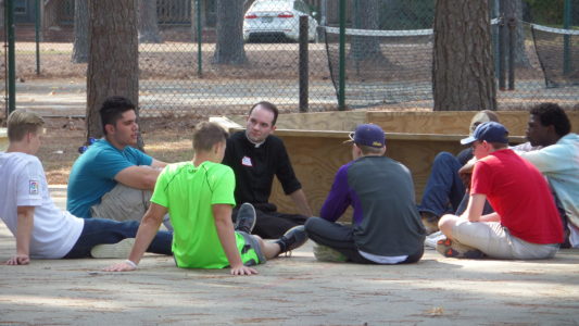 Seminarian Aaron Williams, center, shared some of his vocation story in small group settings. 