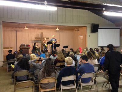 Young people on the Search retreat spend time at liturgies such as this one. Tim Cook and Ellie Smith led music during the retreat.