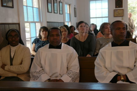 Before the anniversary Mass, Father George Ajuruchi, SSJ, was installed as pastor at Natchez Holy Family and Fayette St. Anne. Some of his friends and family, pictured above, from his home country of Nigeria came for the day of celebrations. (Photo by Valencia Hall)