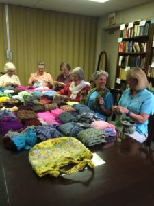 Members of the Merciful Mufflers knitting and crocheting ministry created hats, mufflers and even bags as a work of mercy this year. 