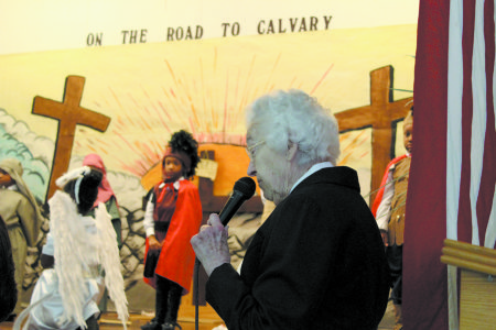 Sister Bernadette McNamara narrates the annual Holy Family Early Learning Center Passion Play in this 2014 file photo.