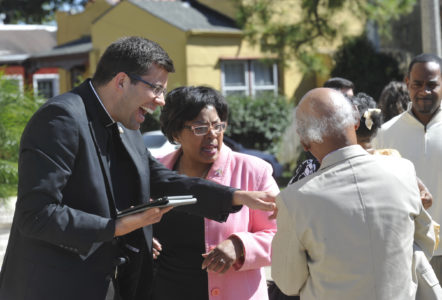 Nick Adam of the Diocese of Jackson, uses an iPad to update family information for St. Rita Parish in New Orleans Oct. 22. (CNS photo/Peter Finney Jr., Clarion Herald) See SEMINARY-PARISH-PARTNERSHIP Dec. 2, 2016.