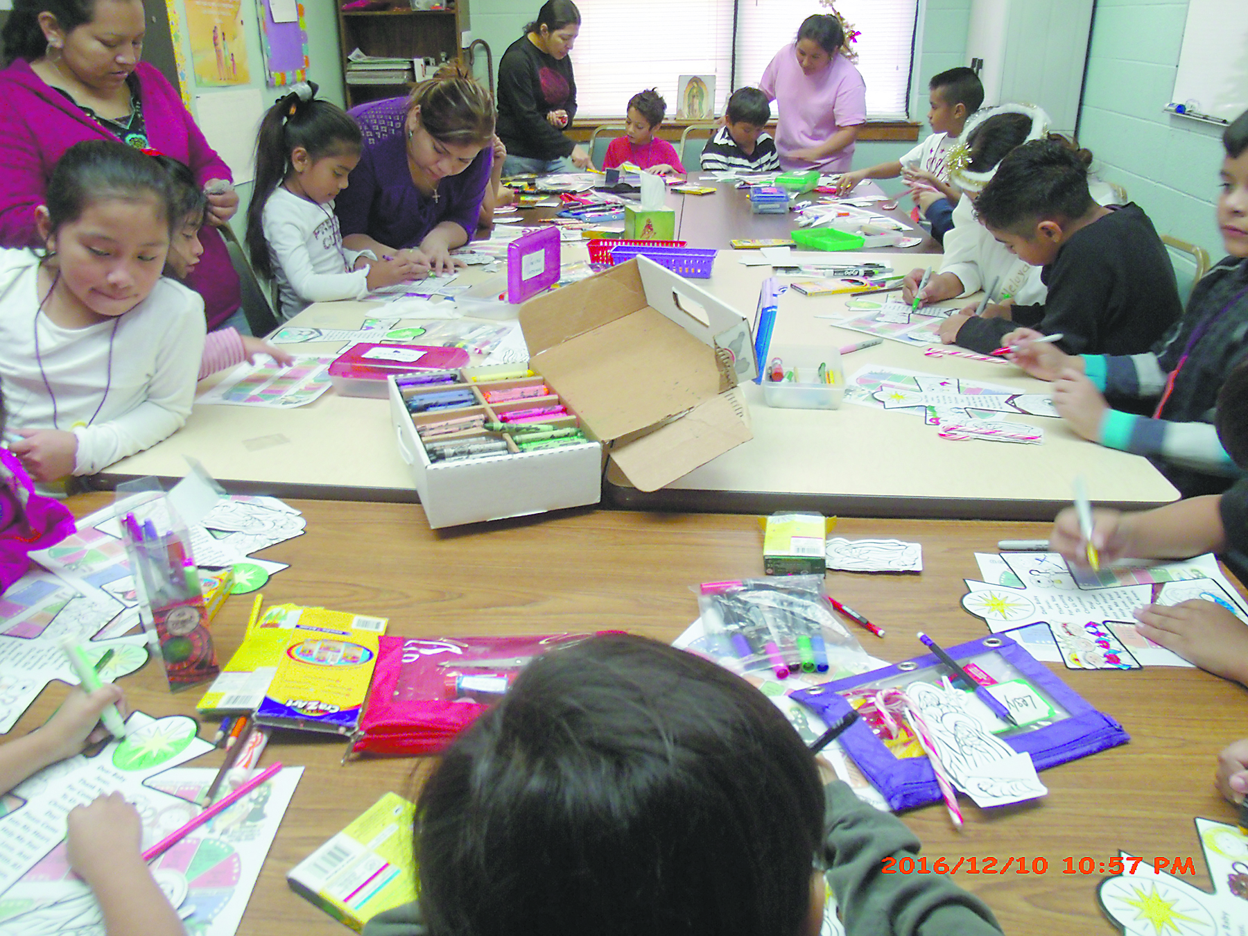 CORINTH – St. James Parish children work in art projects during an Advent retreat on Saturday, Dec. 10. (Photo by Luis Rosales)