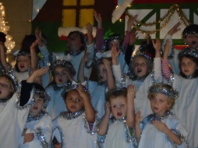 CLARKSDALE – St. Elizabeth Parish children share Christmas joy during the Christmas program. Angels from P-3 and classes from grades fourth and fifth grades participated. (Photo by Dawn Spinks)