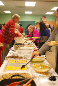 SOUTHAVEN - Christ the King members gathered for a feast after the Mass. 