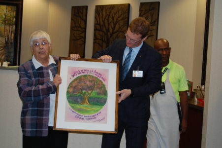 Sister Paulinus Oakes, RSM, donated a painting by a fellow sister to the unit.
