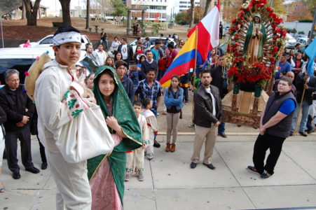 Participants in the Guadalupe Procession wait for the bishop outside the Cathedral of St. Peter the Apostle. 