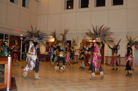 Jackson St. Therese and Holy Family parishes joined together for a celebration of the Feast of Our Lady of Guadalupe. The dancers from St. Therese brought their gifts to Holy Family.  