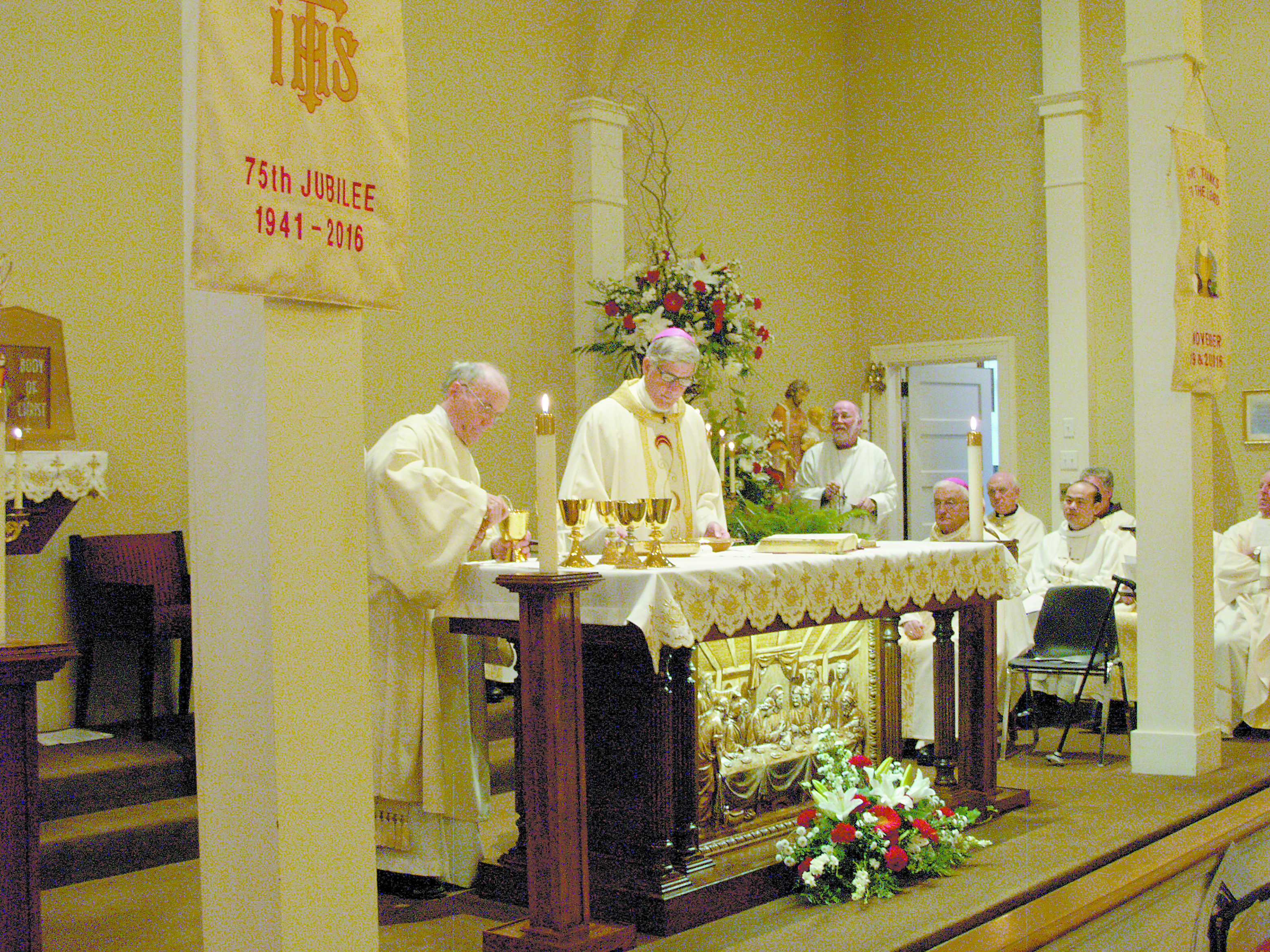 Deacon Senan Gallagher, ST, assists Bishop Kopacz at the altar. 