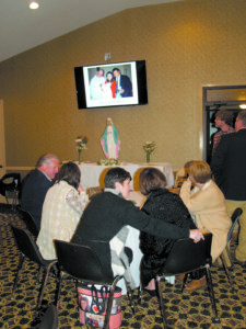 during dinner in the parish hall, families enjoy a slide show of historical photos.