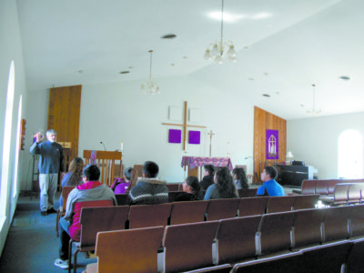 PONTOTOC – Father Tim Murphy, pastor of St. Christopher Parish, talks with the confirmation group during an Advent retreat, “My Church, my Faith.” Saturday, Dec. 10, from 9 a.m. to 1 p.m.