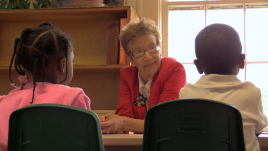 JONESTOWN – Sister Teresa Shields, SNJM, speaks with some of the students at the Jonestown Center in this still from a documentary about her life. (Photo courtesy of True Delta Project)