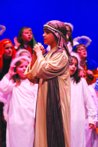 COLUMBUS – Students at Annuncation School presented a Christmas Extravaganza on Tuesday, Dec. 20.  Fifth-grader Elijah Clarke helps act out the Nativity story.  (Photos courtesy of Katie Fenstermacher)