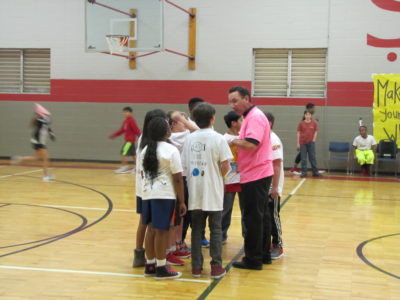 JACKSON -- Father John Bohn, pastor, speaks to the St. Richard School  sixth-grade Newcomb team before the teachers (and pastor) versus students game on the Friday of Catholic Schools Week. 