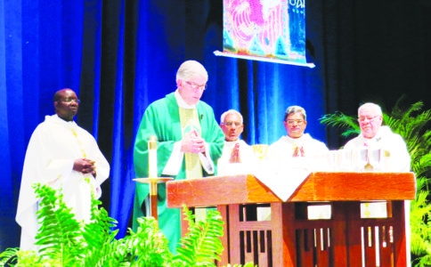 KENNER, LA, - Bishop Kopacz, center, celebrated the closing Mass for the conference with diocesan priests Father Arokia Savio, right of the bishop, pastor of Grenada St. Peter Parish, and Father Paneer Arockiam, pastor of Yazoo City St. Mary Parish. Two local deacons assisted. (Photo by Rhonda Bowden)