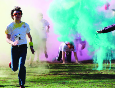 Culumbus - Eighth-grade student, Matthew Swiderski gets dusted at the CSW color run. (PHoto by Katie Fenstermacher)