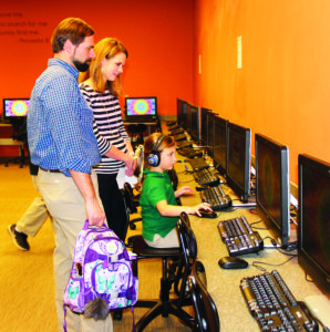 MADISON – Students at Madison St. Anthony School got to show their parents all around their school, including demonstrating the work they do in the computer lab during STREAM night as part of Catholic Schools Week. In the art studio, students demonstrated a motion and balance with a kinetic sculpture, they downloaded and showed off their apps in the computer lab, showed how “Math is everywhere in the math lab and took on an engineering challenge in the media center. STREAM stands for the integration of science, technology, religion engineering, art and math. (Photo courtesy of Kristin Beatty) 