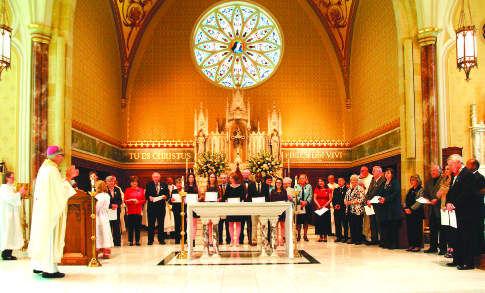 Bishop Kopacz leads the applause for the recipients of the Bishop Chanche Medal and youth awards for service for 2017. The awards were given out during a Mass at the Cathedral of St. Peter the Apostle on Saturday, Feb. 18. (Photo by Maureen Smith)