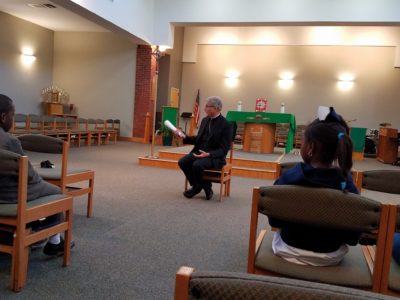 JACKSON – Bishop Joseph Kopacz spoke with students at St. Thea Bowman school before a prayer service to celebrate Catholic Schools Week. (Photo by Karla Luke)