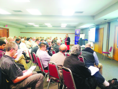 CANTON – Lucille Smith, center, top photo, from Catholic Leadership Institute, speaks to the convocation.