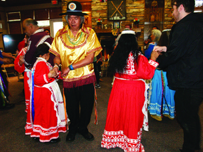 PHILADELPHIA – Dancers demonstrate a social dance and their native dress. The ribbons,ruffles and medallions all have meanings. 